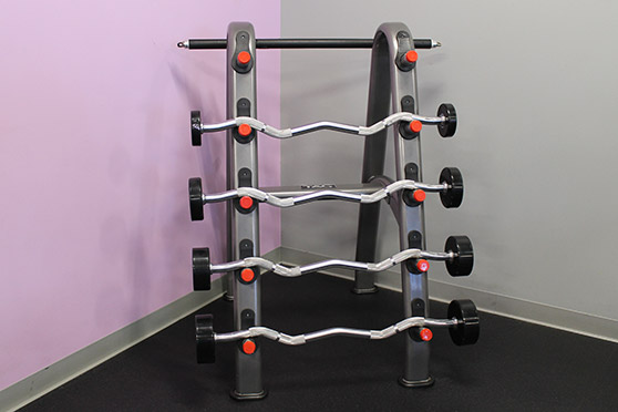 Rack with several bar weights.